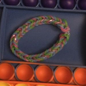 Green, Blue, and Pink stretchy rubber band bracelet.